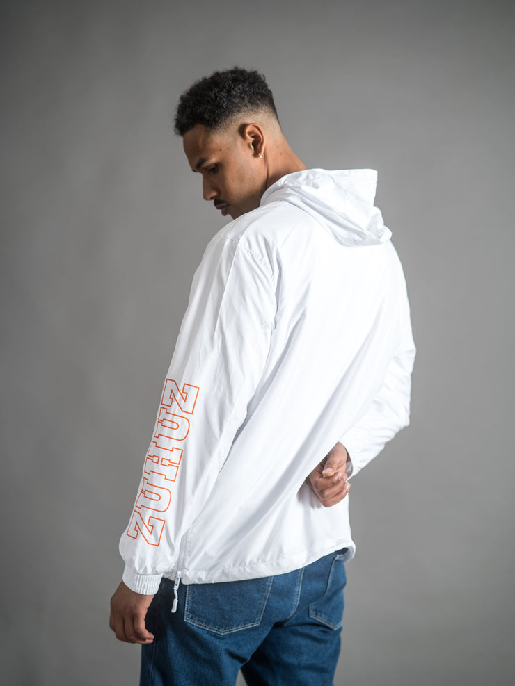 basic pull over jacket in white with zuhuz print and zuhuz logo print in black and orange
